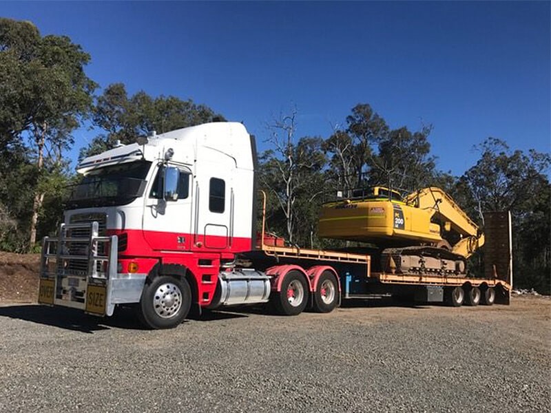 Large truck with machinery on back to move scrap metal