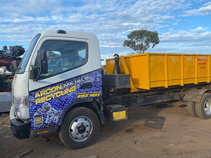 Arcon Recycling truck with yellow bin on back
