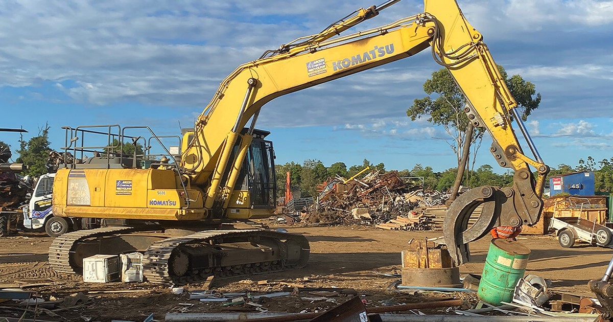 Large machinery moving heavy scrap metal by Arcon Metals